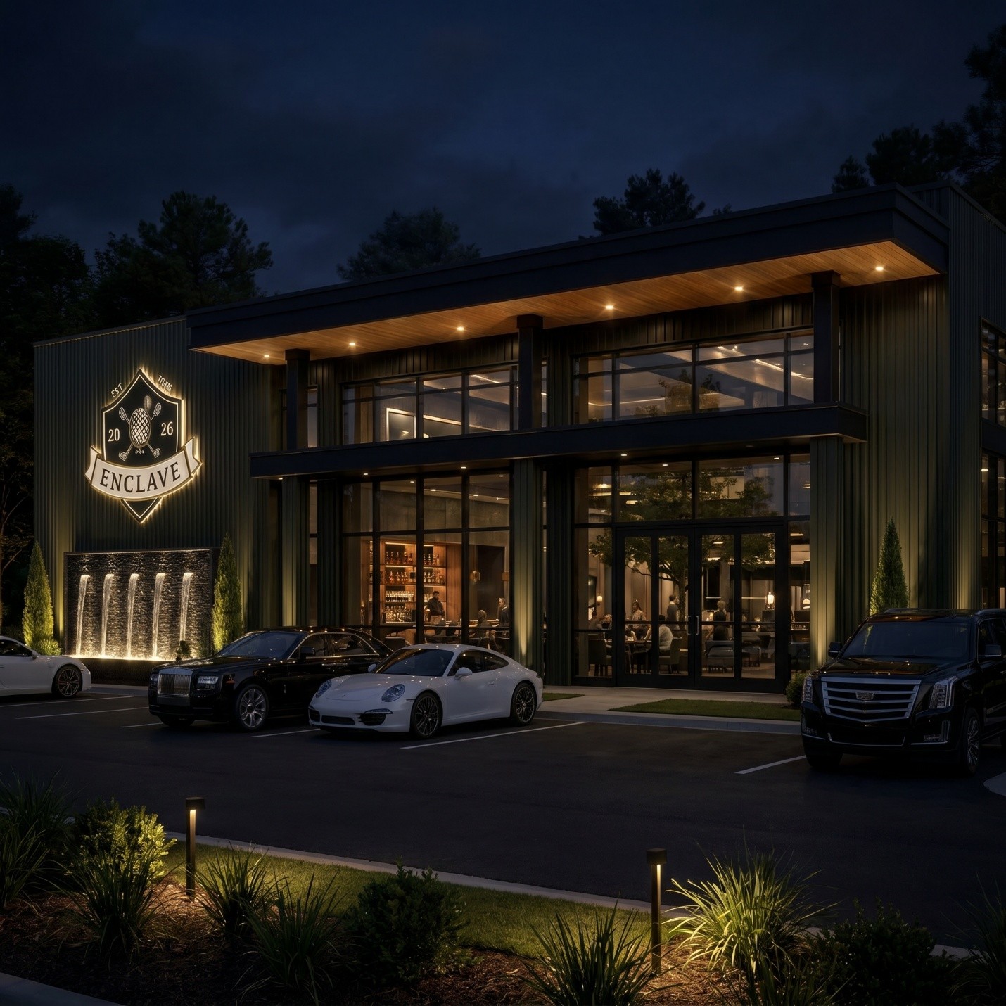 Nighttime exterior view of Enclave with illuminated signage and architectural lighting.